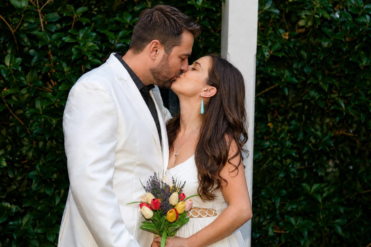 Newlyweds share their first kiss at the end of a Big Dawg Weddings ceremony